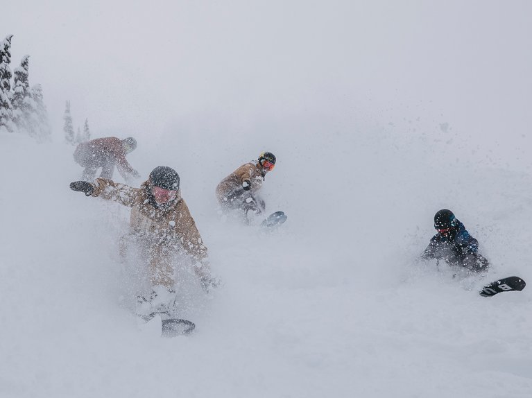 A group of riders in powder