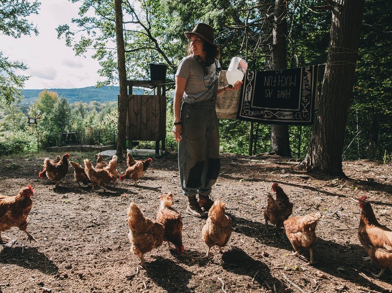 Taylor Mayo feeding her chickens
