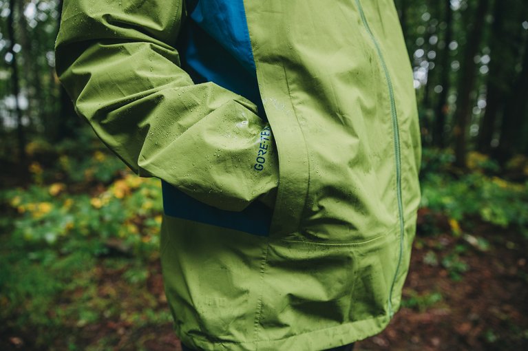 A hand stuffed inside the pocket of a Men's Packrite jacket. Nice and dry.