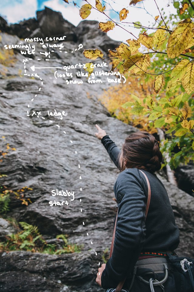 Sarah pointing out the climbing route