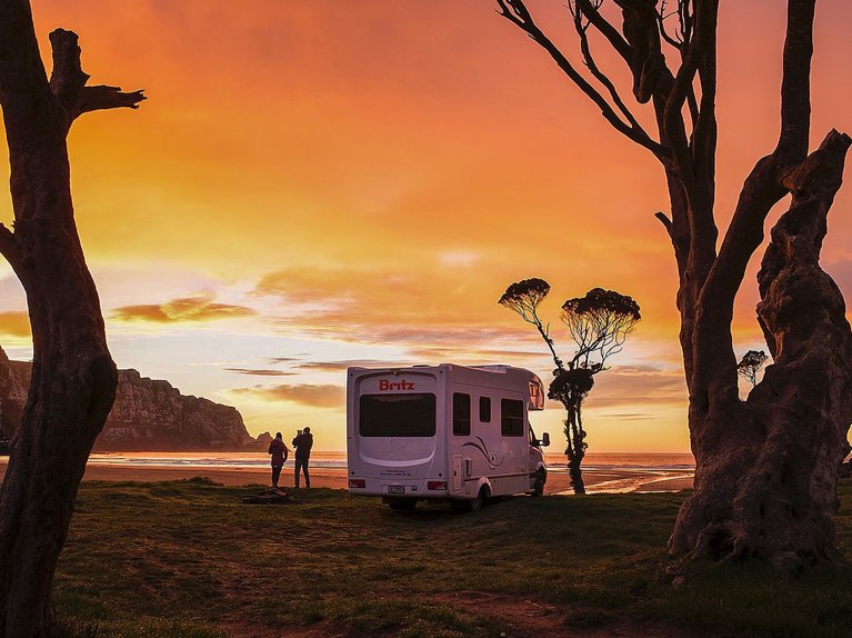 Kimmy Fasani's RV at a beach in New Zealand