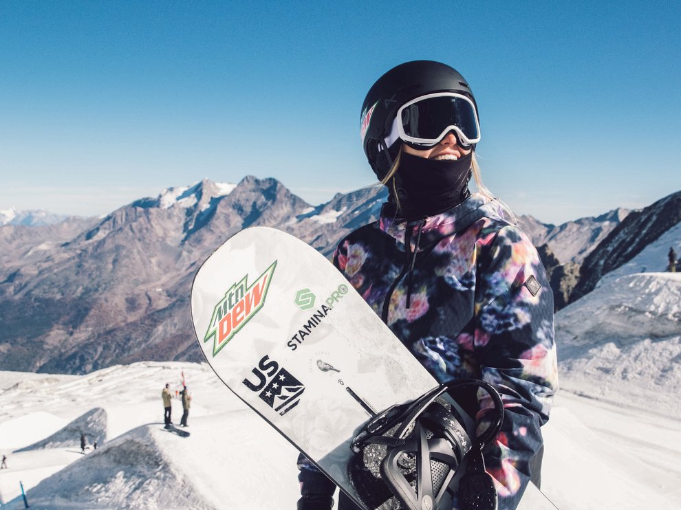 Julia Marino holding snowboard