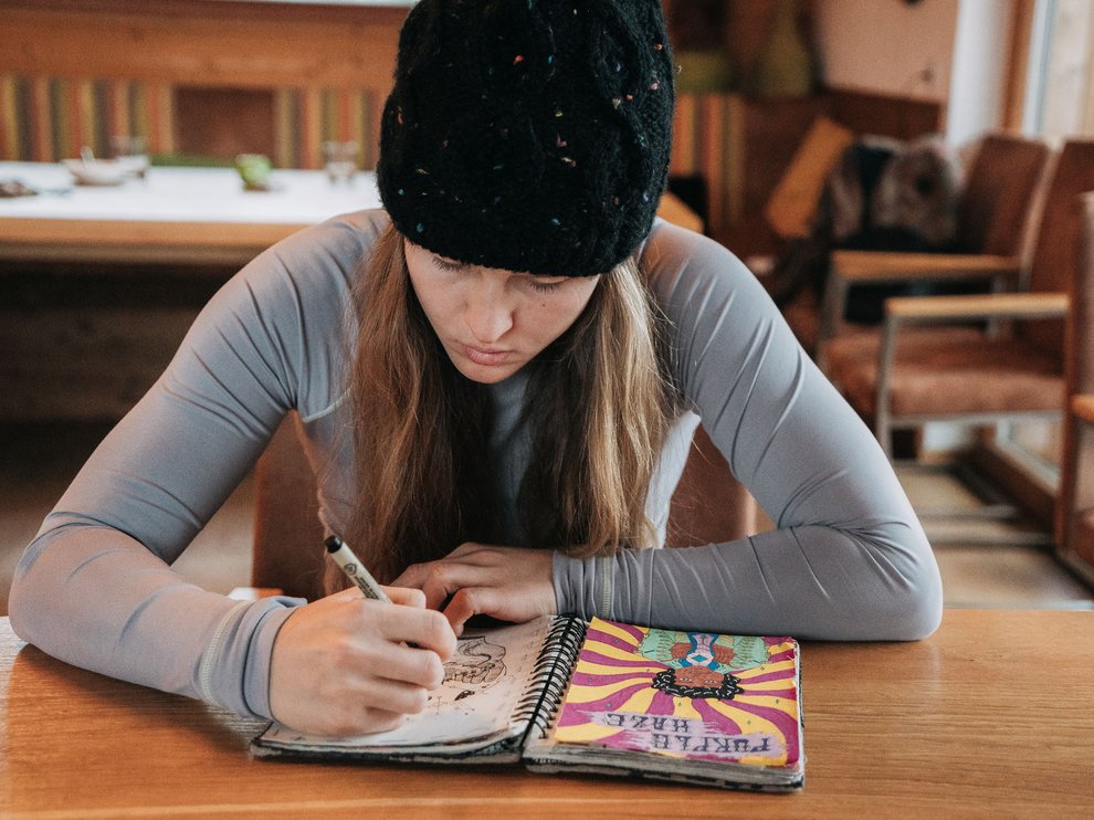 Julia Marino drawing in her notebook in Austria_Blotto_5227.jpg