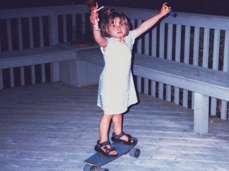 Young Julia Marino on a skateboard