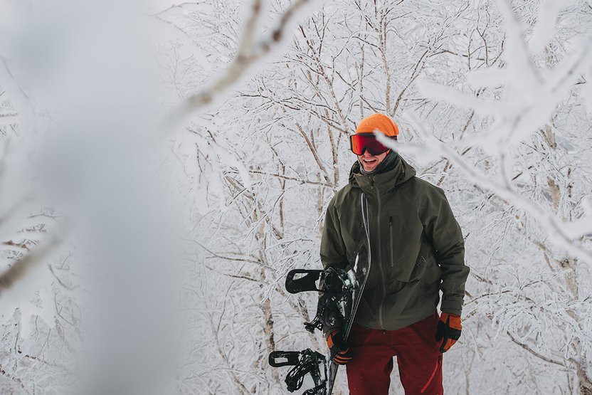 Hiking up for another hit wrapped in [ak] base layers and outerwear.