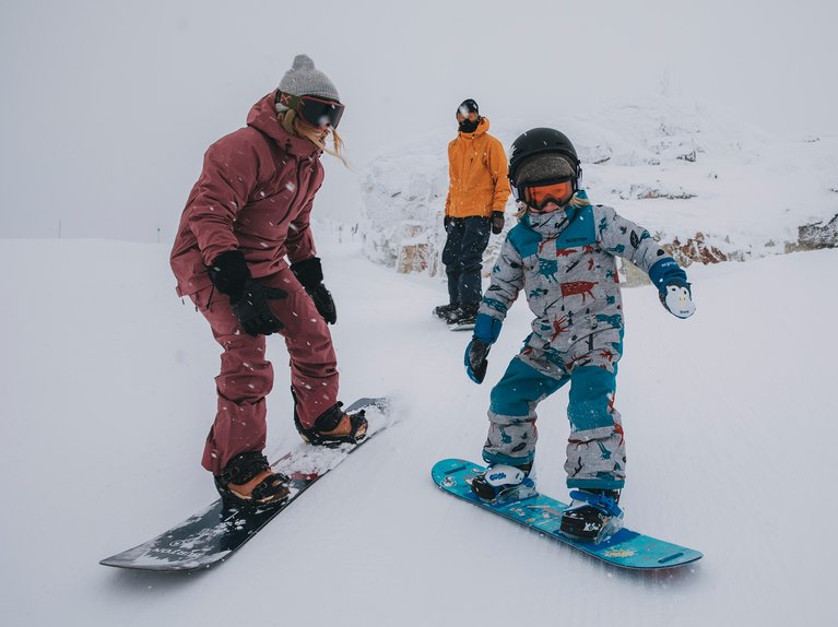 Burton Ambassador Kate Ediger and her son snowboarding