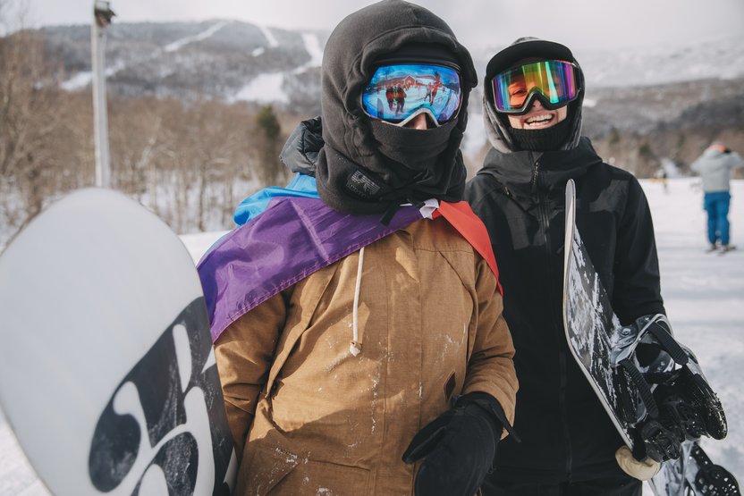 Burton employees, Jenna and Bridget, all smiles on a day spent celebrating representation and snowboarding.